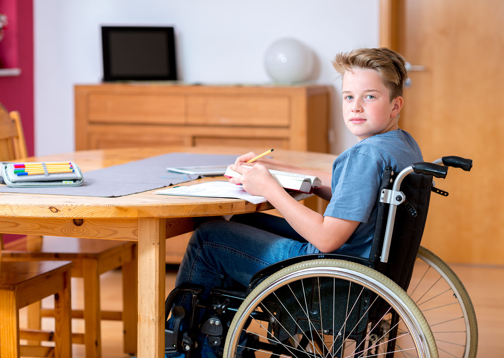 Boy In Wheelchair Doing Homework